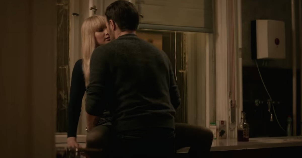 In this scene, she wakes up semi-nude in a... Red Sparrow. 